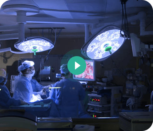 Surgeons in a dimly lit operating theater at the Sheba Medical Center.