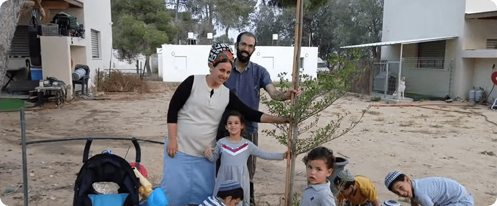 Amichai with his family. An Israeli man with his wife and children.